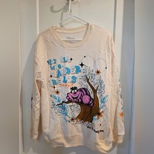Disney Cream Sweatshirt with Purple and Blue Cheshire Cat Design